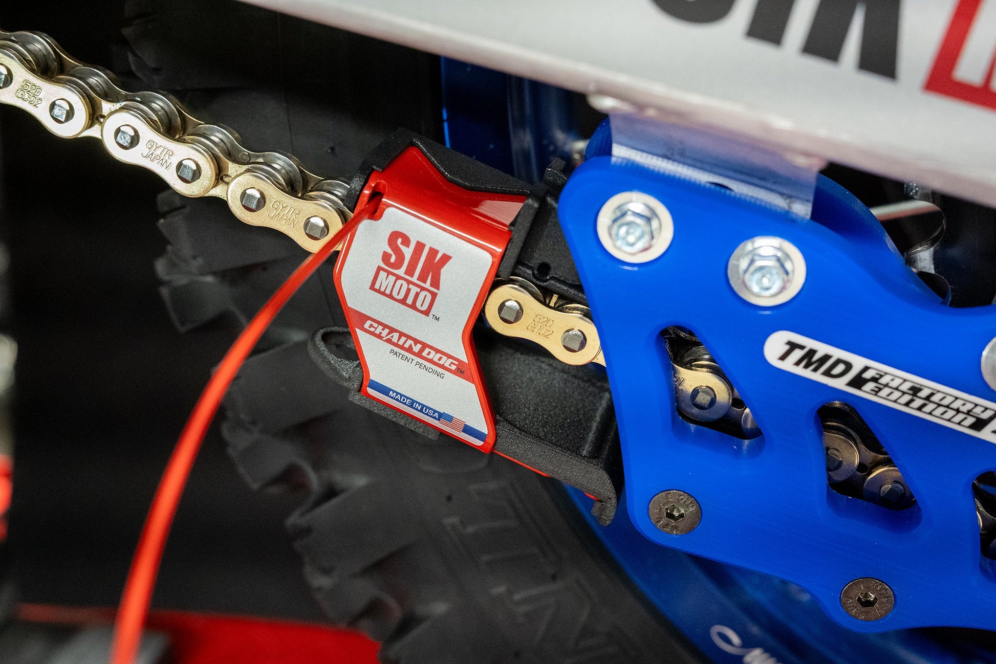 Close-up of SIK Moto Chain Dog with drip tray