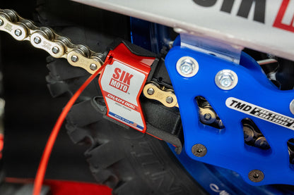 Close-up of SIK Moto Chain Dog with drip tray